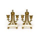 A Pair of French Gilt Metal and White Marble Twin-Light Candelabra, circa 1870, with fluted