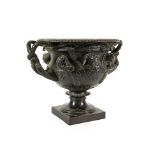 After the Antique: A Bronze Warwick Vase, of typical form, on a square plinth, 34cm wide Having been