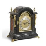 A Victorian Ebonised Chiming Table Clock, circa 1880, arched pediment with urn shaped finials,