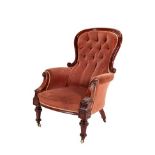 A Victorian Mahogany Armchair, circa 1870, recovered in pink buttoned velvet, with moulded frame,