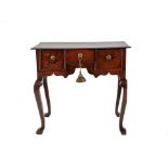 A George II Oak Dressing Table, 2nd quarter 18th century, the moulded top above three small