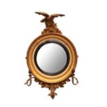 A Regency Gilt and Ebonised Two-Branch Girandole Mirror, early 19th century, the reeded and ebonised