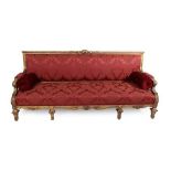 A French Carved Giltwood Sofa, late 19th century, in Louis XIV style, recovered in red and floral