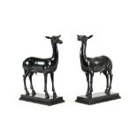 After the Antique: A Pair of Bronze Figures of Daini, standing four-square on rectangular bases,