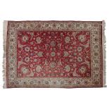 Tabriz Carpet North West Iran, circa 1950 The faded blood red field with an allover design of