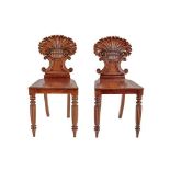 A Pair of Early 19th Century Shell Carved Mahogany Hall Chairs, in the manner of Gillows, with C