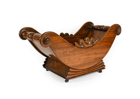 A George IV Mahogany Cheese Coaster, of traditional form with scroll crestings, turned handles and