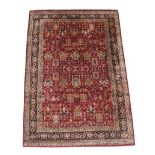 Large Indian Carpet, modern The brick red field with an allover design of flowing vines and