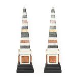 A Pair of Specimen Marble Obelisks, in George III style, on stepped square slate bases, 49cm high