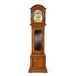 An Oak Tubular Bell Chiming Longcase Clock, early 20th century, arched pediment, bevelled glass hood