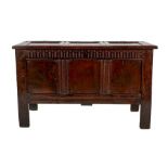 A Late 17th Century Joined Oak Chest, the three panel moulded and hinged lid enclosing a candle