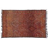 Moroccan Village Rug, circa 1970 The pale aubergine diamond lattice field containing stepped