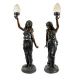 A Pair of French Bronze Figural Torcheres, early 20th century, as classical maidens standing holding