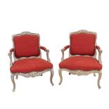 A Pair of Late 19th/Early 20th Century Louis XV Style Carved Limed Oak Fauteuils, recovered in