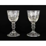 A Pair of Wine Glasses, circa 1740, the rounded funnel bowls later engraved with hunting scenes,