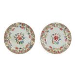 A Pair of Chinese Porcelain Chargers, Yongzheng/Qianlong, painted in famille rose enamels with peony