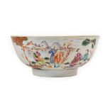 A Chinese Porcelain Punch Bowl, Qianlong, painted in famille rose enamels with figures in fenced