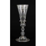 A Wine Glass, circa 1720, the conical bowl with solid base and blade collar, on triple ball