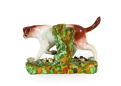 A Derby Porcelain Figure of a Hound, circa 1790, on a mound base, 16.5cm long. Restoration to - Image 2 of 2