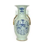 A Chinese Porcelain Baluster Vase, 19th century, with stylised beast handles, painted in