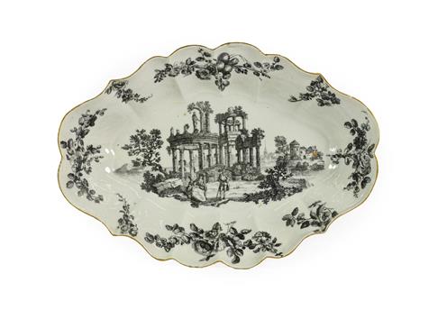 A Worcester Porcelain Dessert Dish, circa 1770, of fluted oval form, printed en grisaille with