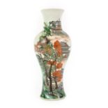 A Chinese Porcelain Vase, late 19th century, of baluster form with flared neck, painted in famille