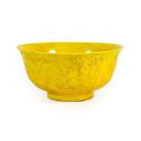 A Chinese Yellow Glazed Porcelain Bowl, Hongzhi reign mark but not of the period, moulded with