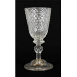 A Glass Goblet, circa 1730, the rounded funnel bowl moulded with ''Nipt diamond waies'' on a