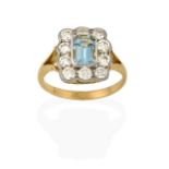 An Aquamarine and Diamond Cluster Ring, the emerald-cut aquamarine within a cluster of round