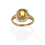 A Chrysoberyl and Diamond Cluster Ring, the octagonal shaped chrysoberyl within a border of old