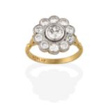 A Diamond Cluster Ring, an old cut diamond within a spaced border of smaller old cut diamonds, in