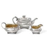 A Three-Piece George III and George IV Silver Tea-Service, The Teapot Maker's Mark Worn, London,