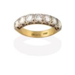 An 18 Carat Gold Diamond Seven Stone Ring, the round brilliant cut diamonds in white claw