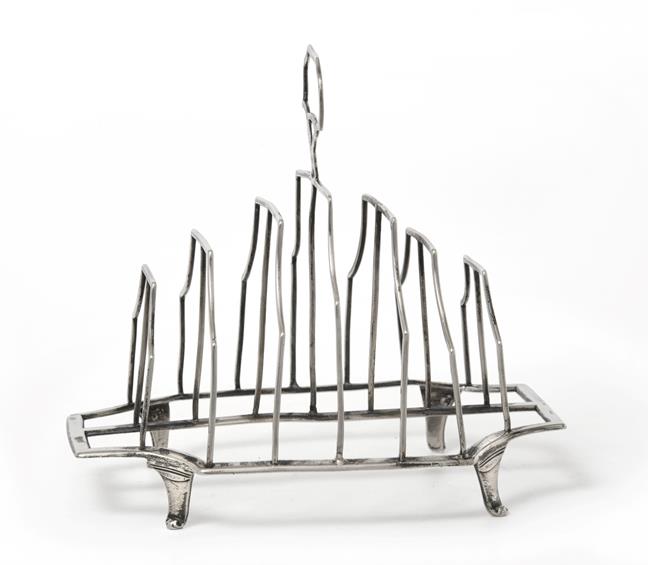 A George III Silver Toast-Rack, by Michael Plummer, London, 1792, shaped oblong and on four panel