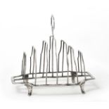 A George III Silver Toast-Rack, by Michael Plummer, London, 1792, shaped oblong and on four panel