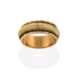 A Victorian Band Ring, the yellow textured band with an uneven border, finger size Q see