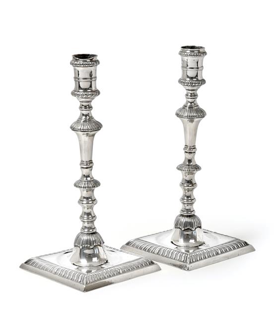 A Pair of George III Silver Candlesticks, Maker's Mark WT, London, 1774, each on stepped square