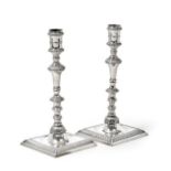 A Pair of George III Silver Candlesticks, Maker's Mark WT, London, 1774, each on stepped square