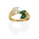 An Emerald and Diamond Ring, pairs of pear shaped emeralds and pear shaped diamonds, in a twist