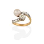 A Diamond and Cultured Pearl Twist Ring, the old cut diamond diagonally set to a cultured pearl,