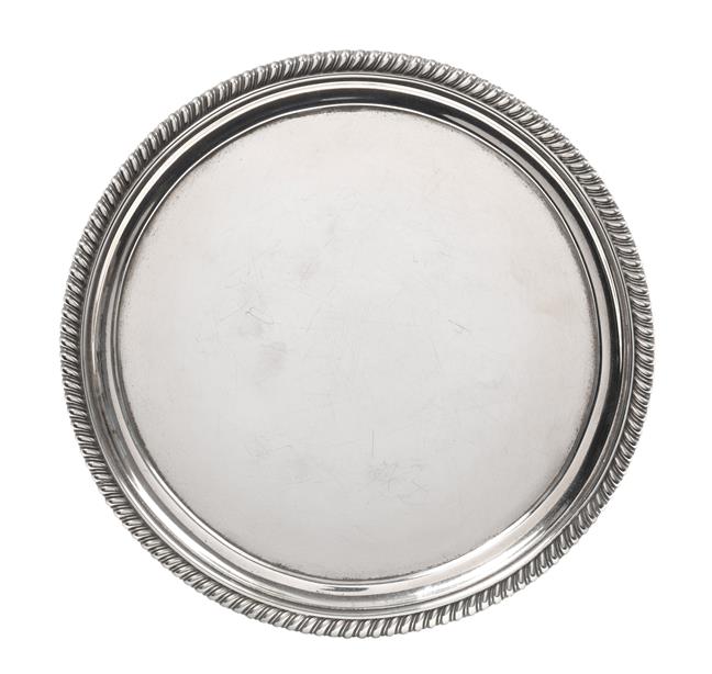 A George III Silver Salver, by John Mewburn, London, 1824, circular and on three scroll and paw cast