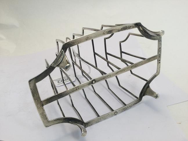 A George III Silver Toast-Rack, by Michael Plummer, London, 1792, shaped oblong and on four panel - Image 3 of 5