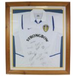 Leeds United Football Club Signed Shirt bearing 14 signatures including Eddie Gray, framed with