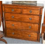 An Edwardian oak four height chest of drawers, lacking feet, 126cm by 58cm by 117cm