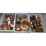 Three boxes of miscellaneous items, including carved wooden figures, Eastern brass ornaments, mesh