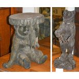 A Black Forest style bear umbrella stand in resin, together with a resin Black Forest seated bear