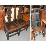 A pair of George III carved oak side chairs, with acanthus baluster splats, raised on square