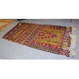 Unusual Anatolian Prayer kilim, the field with an olive green panel beneath a steep Mihrab above a