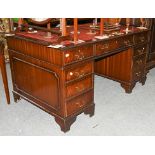 A reproduction mahogany twin pedestal desk with leather inset top, 150cm by 90cm by 80cm