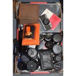 A quantity of camera lenses and equipment